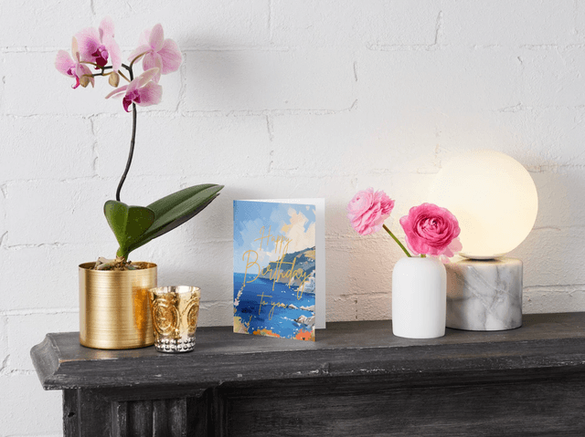 Person writing in birthday card